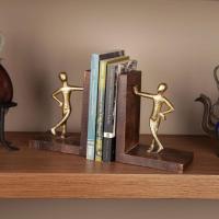 Gold men leaning bookends